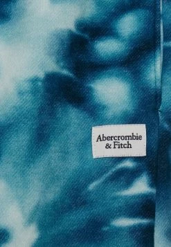 Abercrombie & Fitch THRIFTED GIFT PATCH DYE EFFECT UNISEX - Tracksuit Bottoms - Blue -Abercrombie & Fitch Shop b75abd0f794b42acb19f0ff0e1c515f6